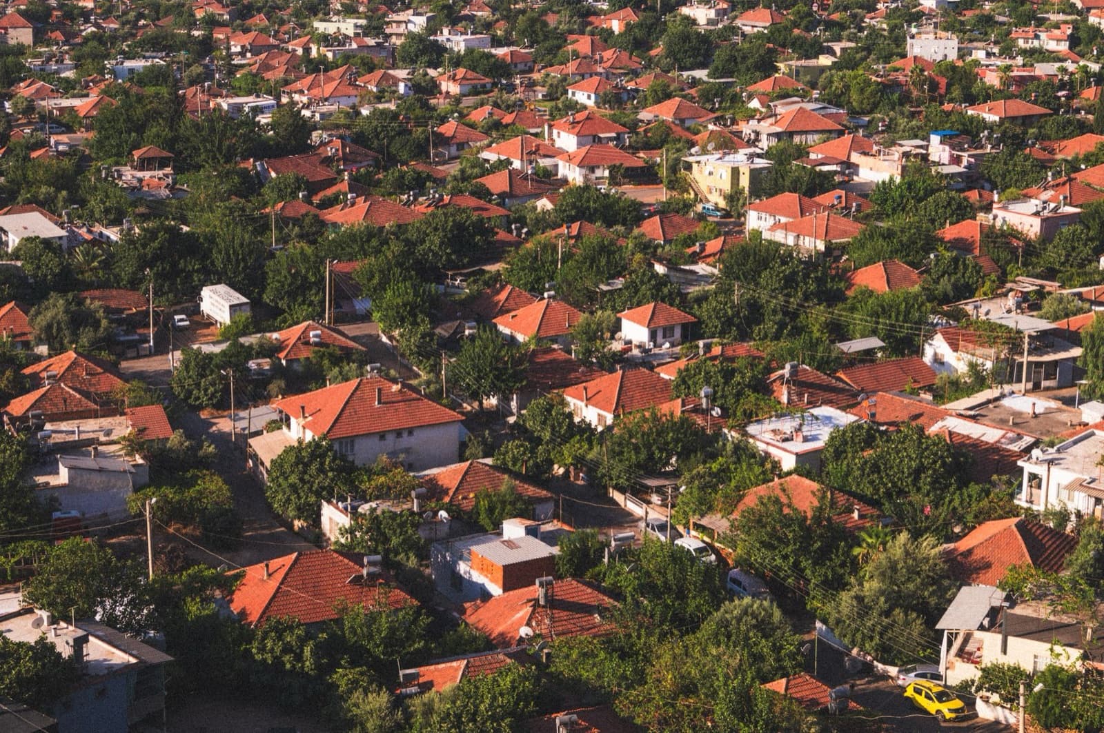 Aerial view of homes with red tile roofs