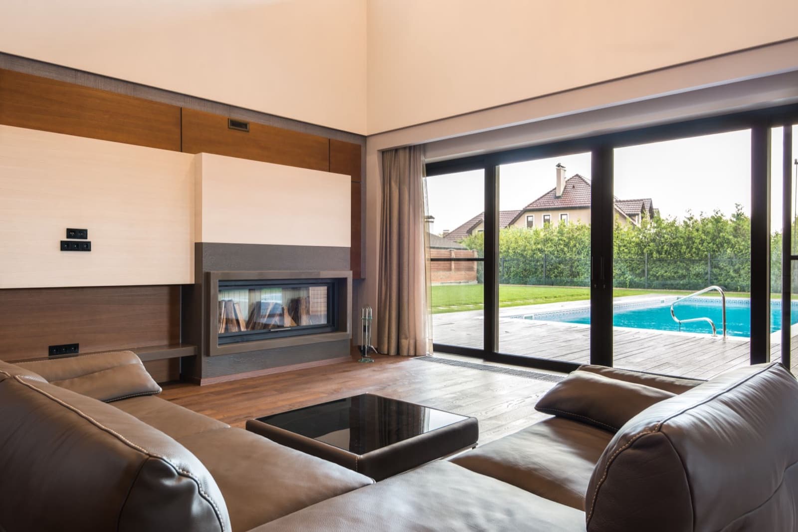 Living room sliding doors opening to a pool