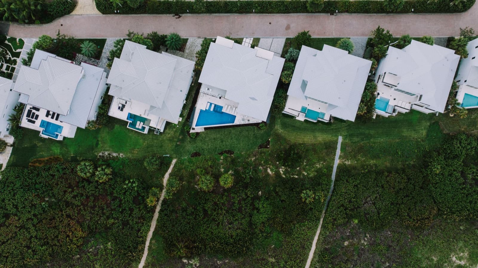 Aerial view of homes with pools
