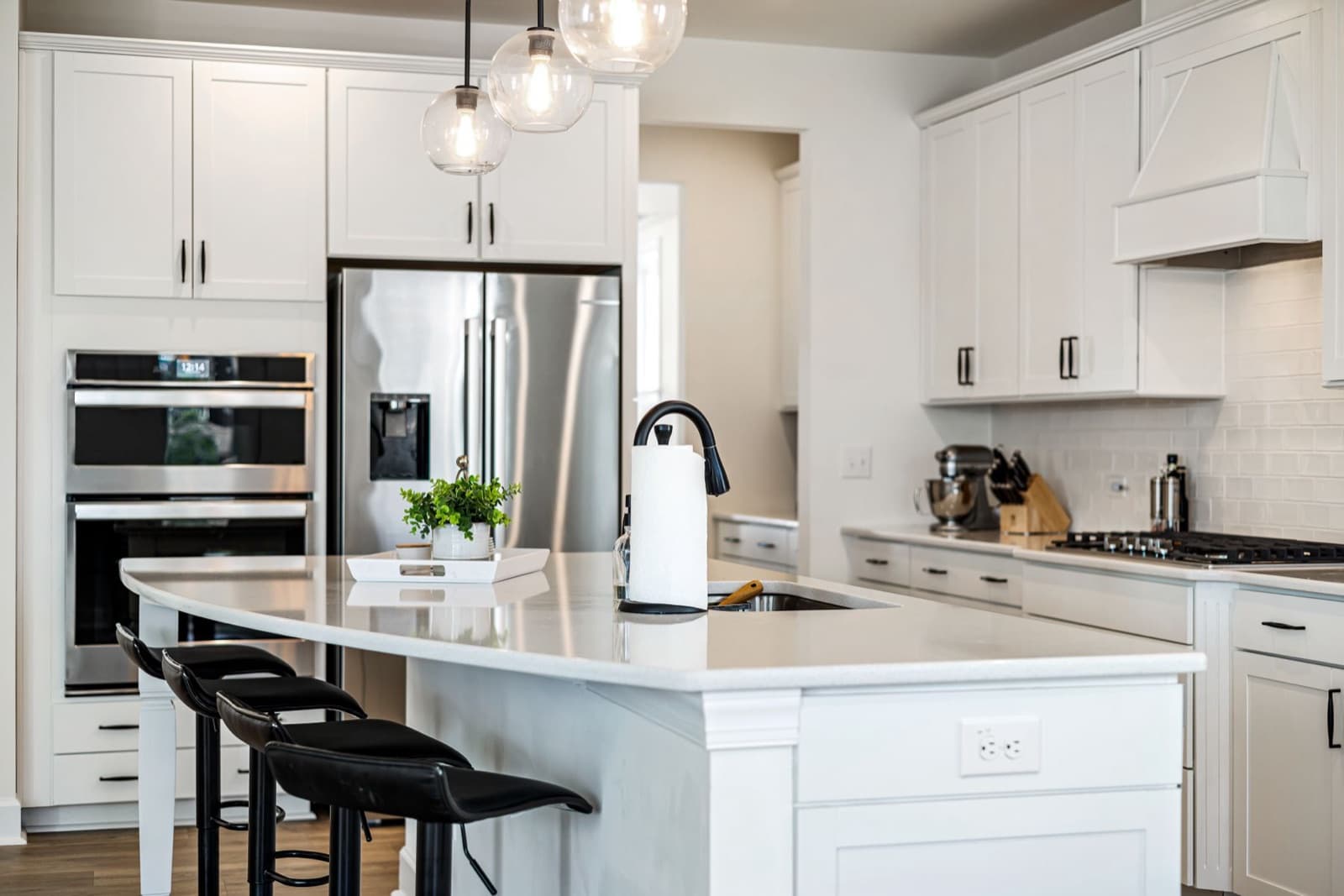 Kitchen with white cabinets and stainless appliances