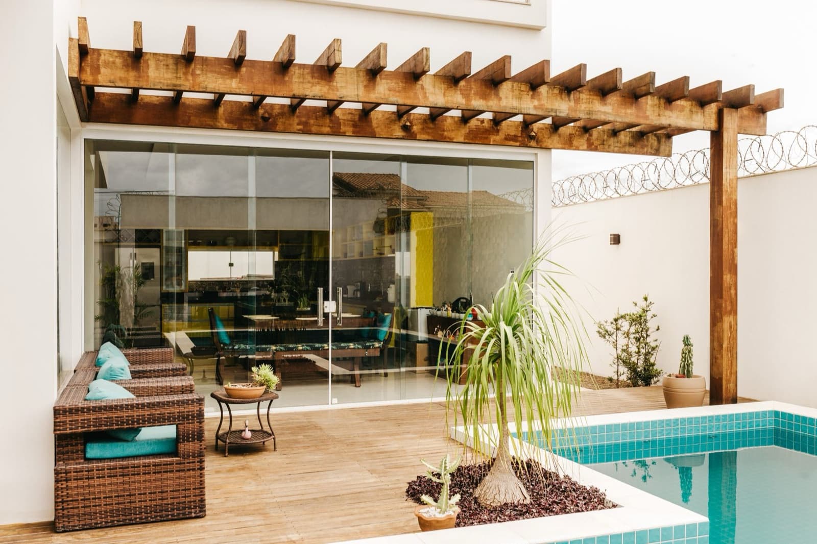 Covered terrace beside a pool