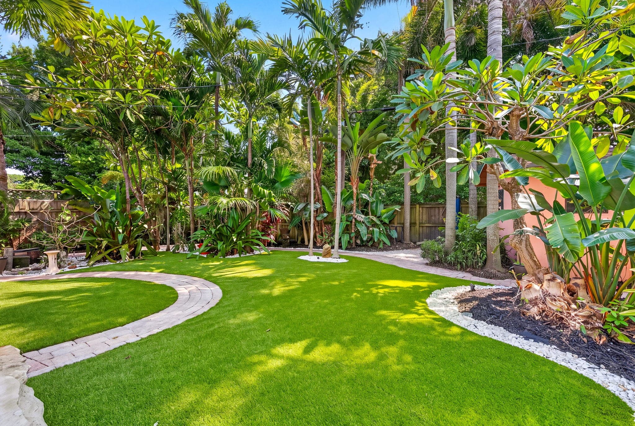 Finished lawn and paver circle from the back of the yard