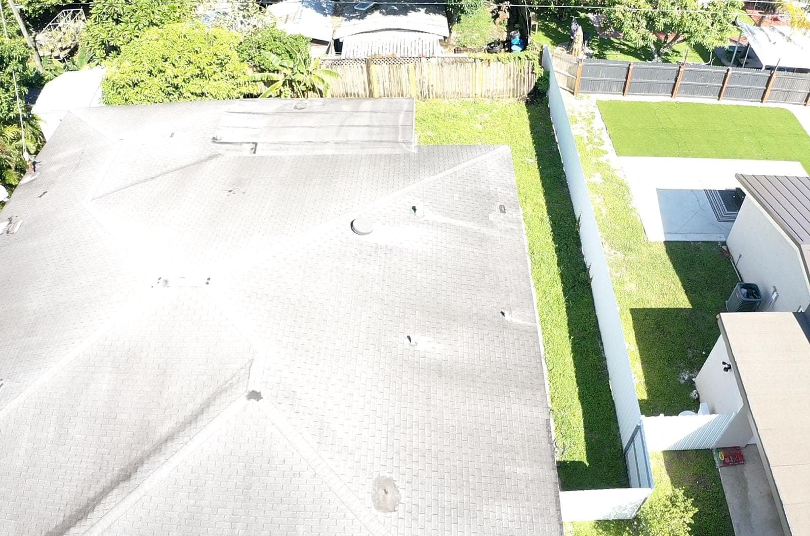 Drone view of a white flat roof on a South Florida home