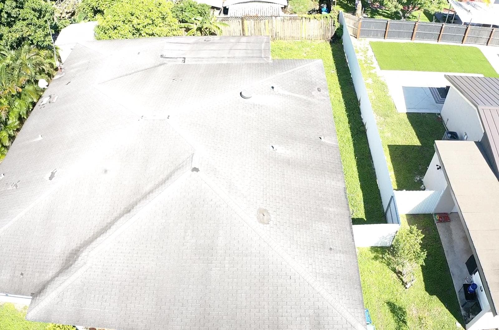 Overhead view of a flat roof with granulated cap sheet