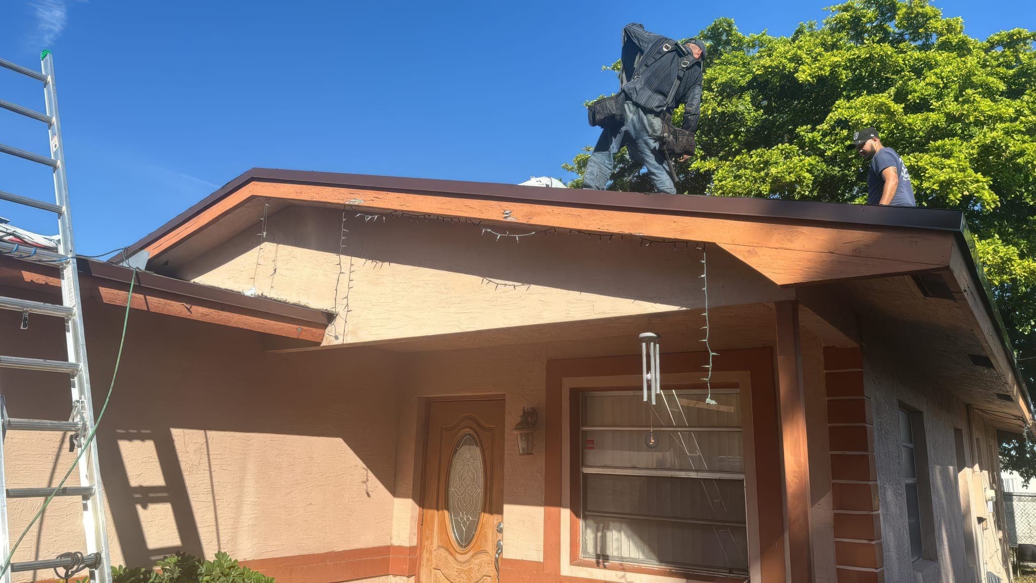 Front of the single-story Hollywood home with scaffolding up during the re-roof