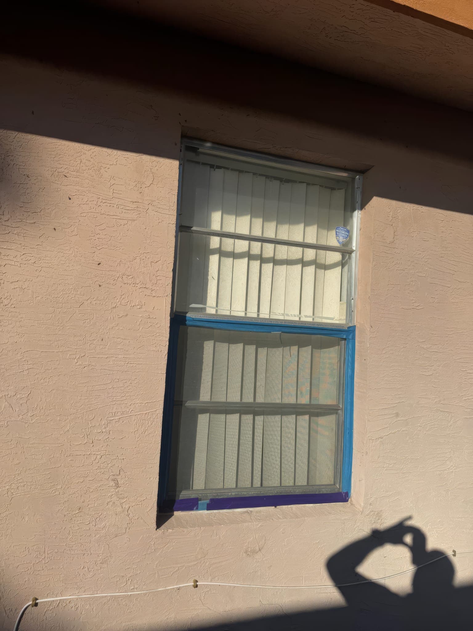 Old jalousie window photographed before removal