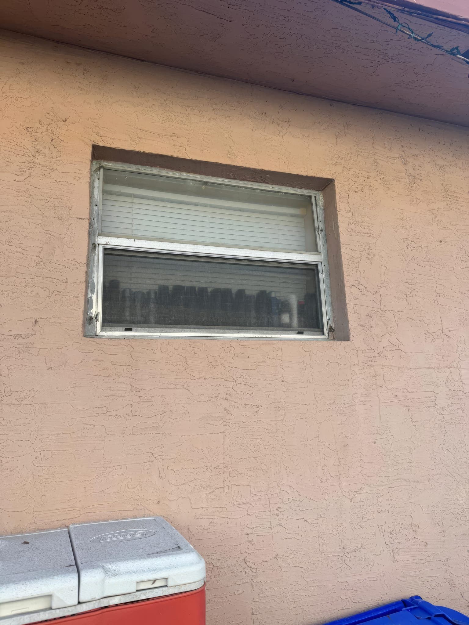 Original side window with jalousie panes before replacement