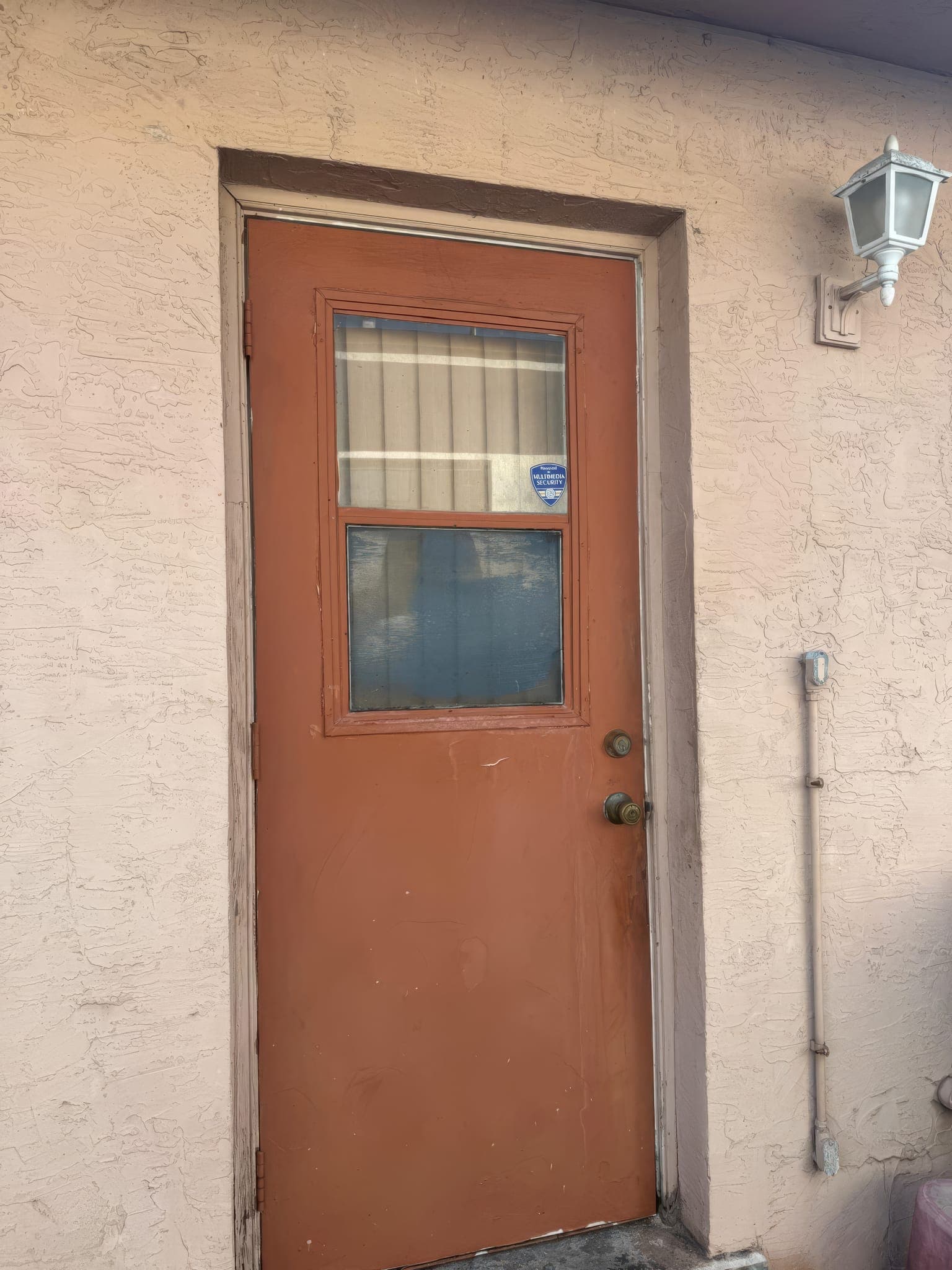 Original side door with a single-pane lite before replacement