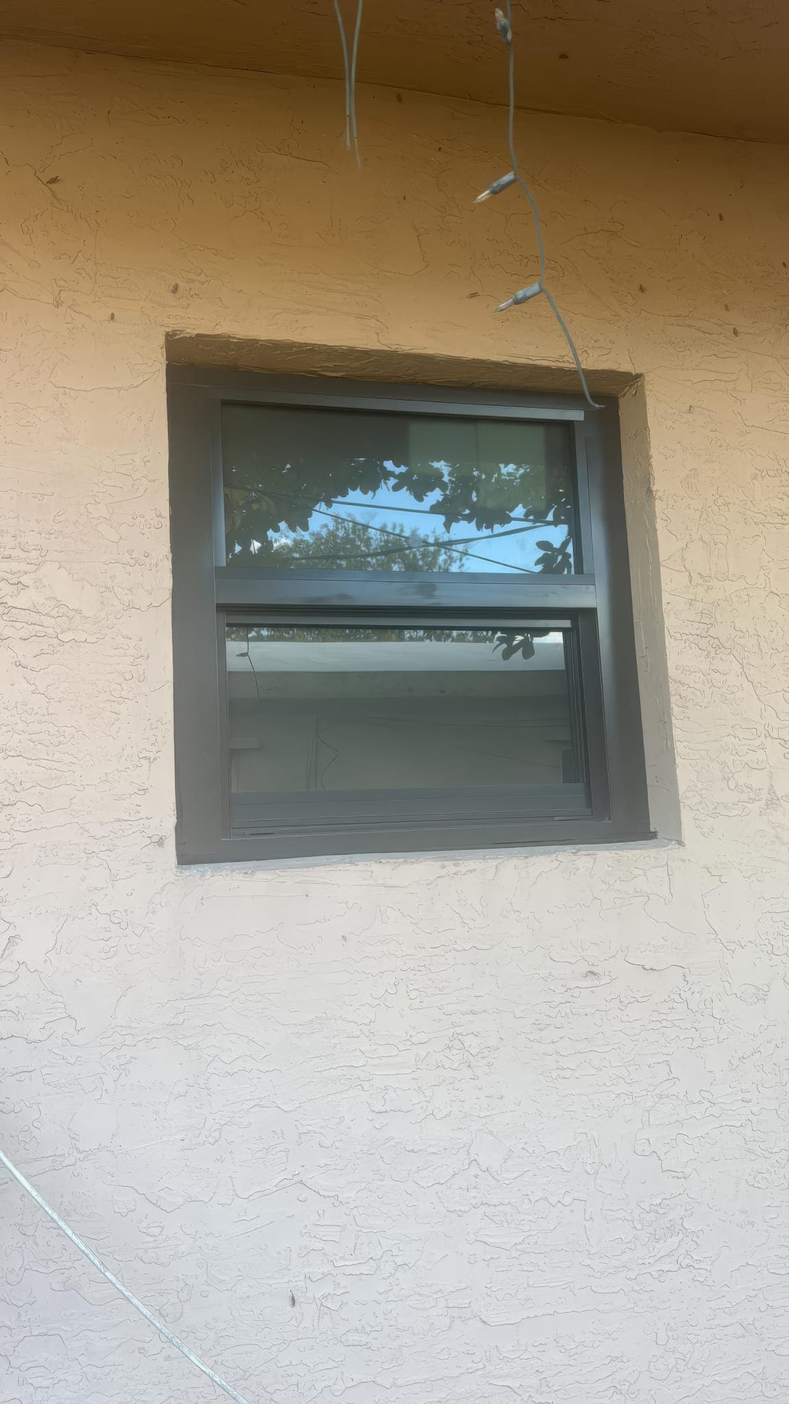 New impact-rated window installed and sealed