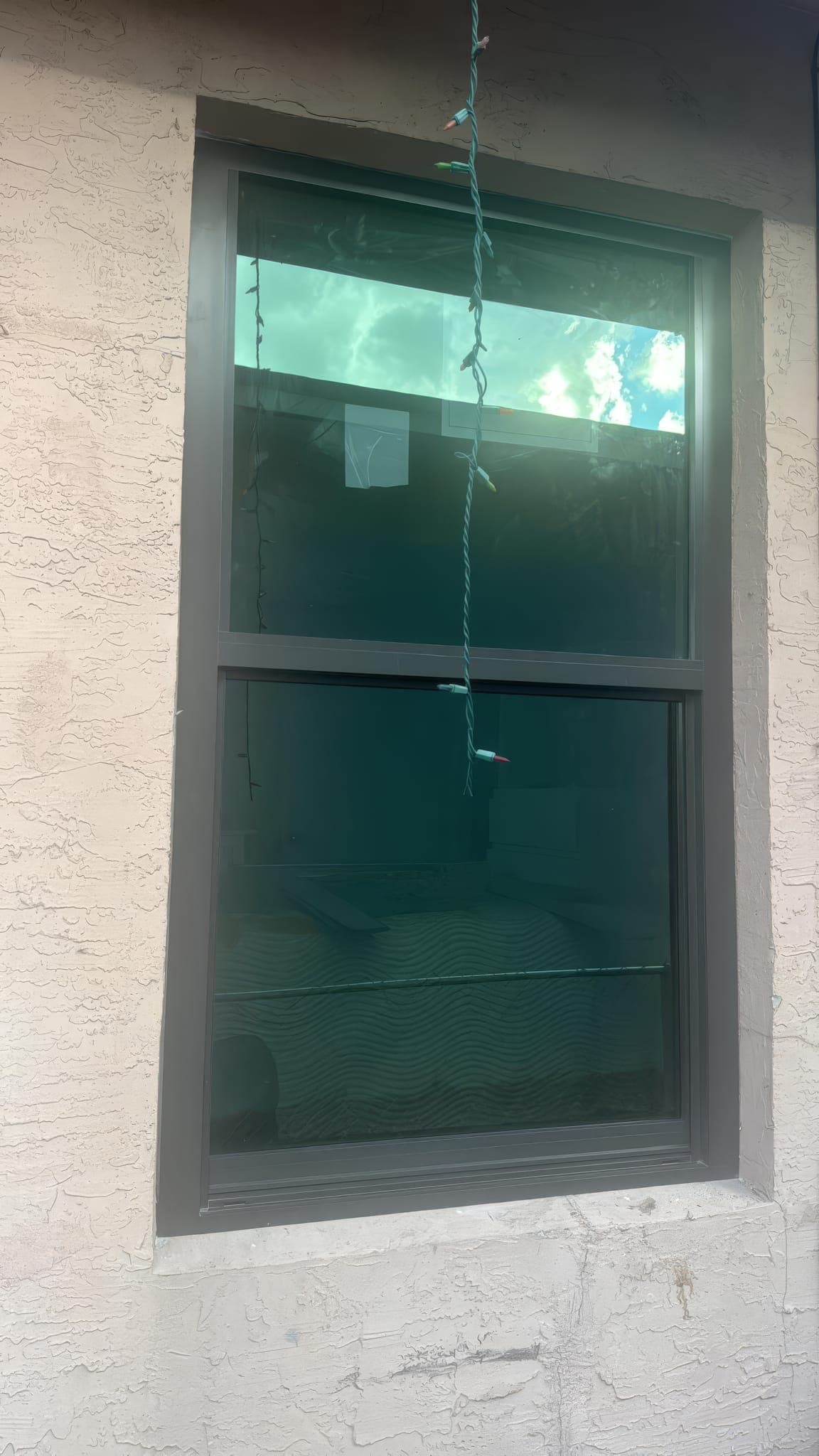 Impact-rated single-hung window installed where a jalousie window used to be