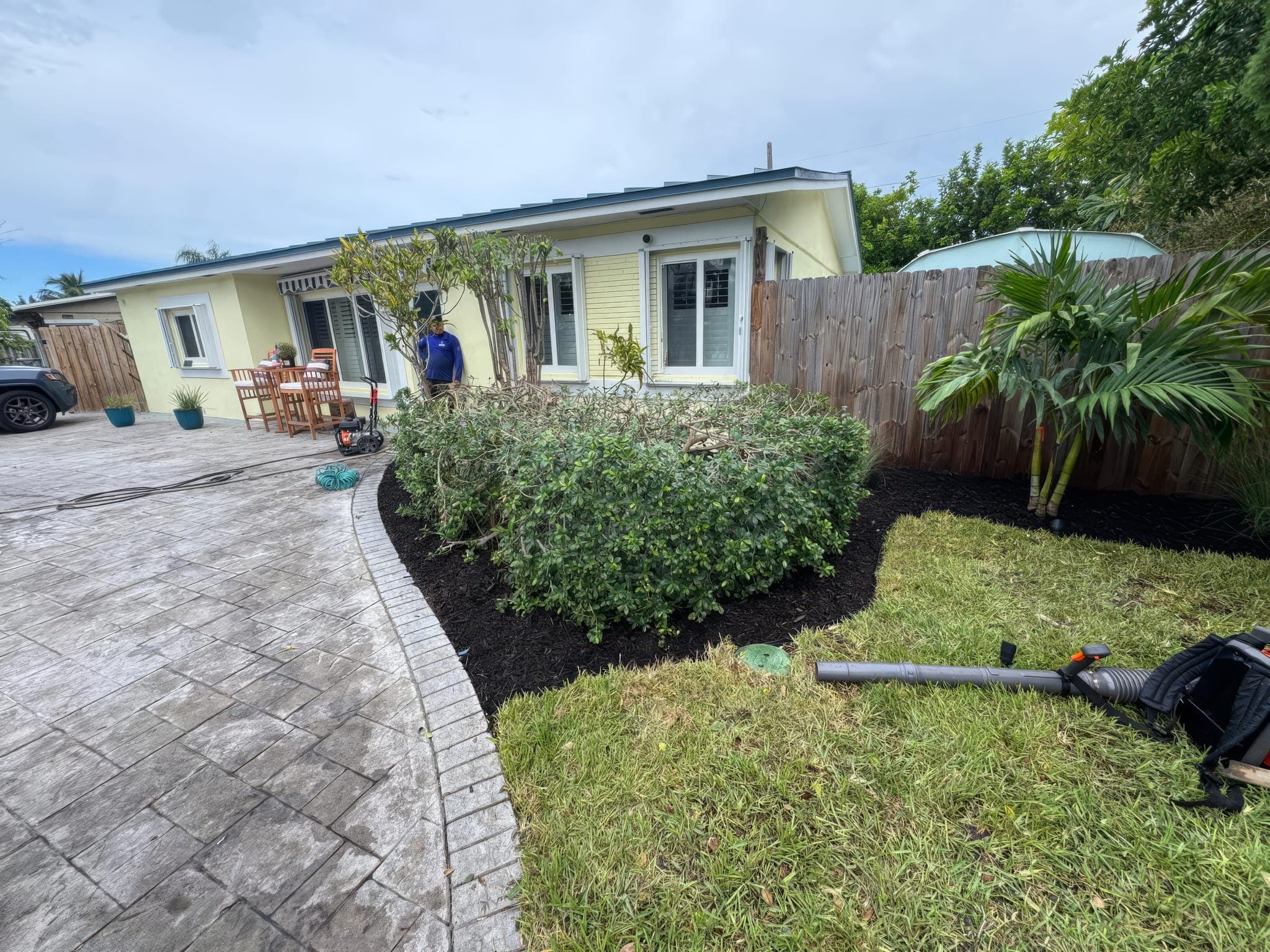 Curved paver walkway with fresh mulch beds