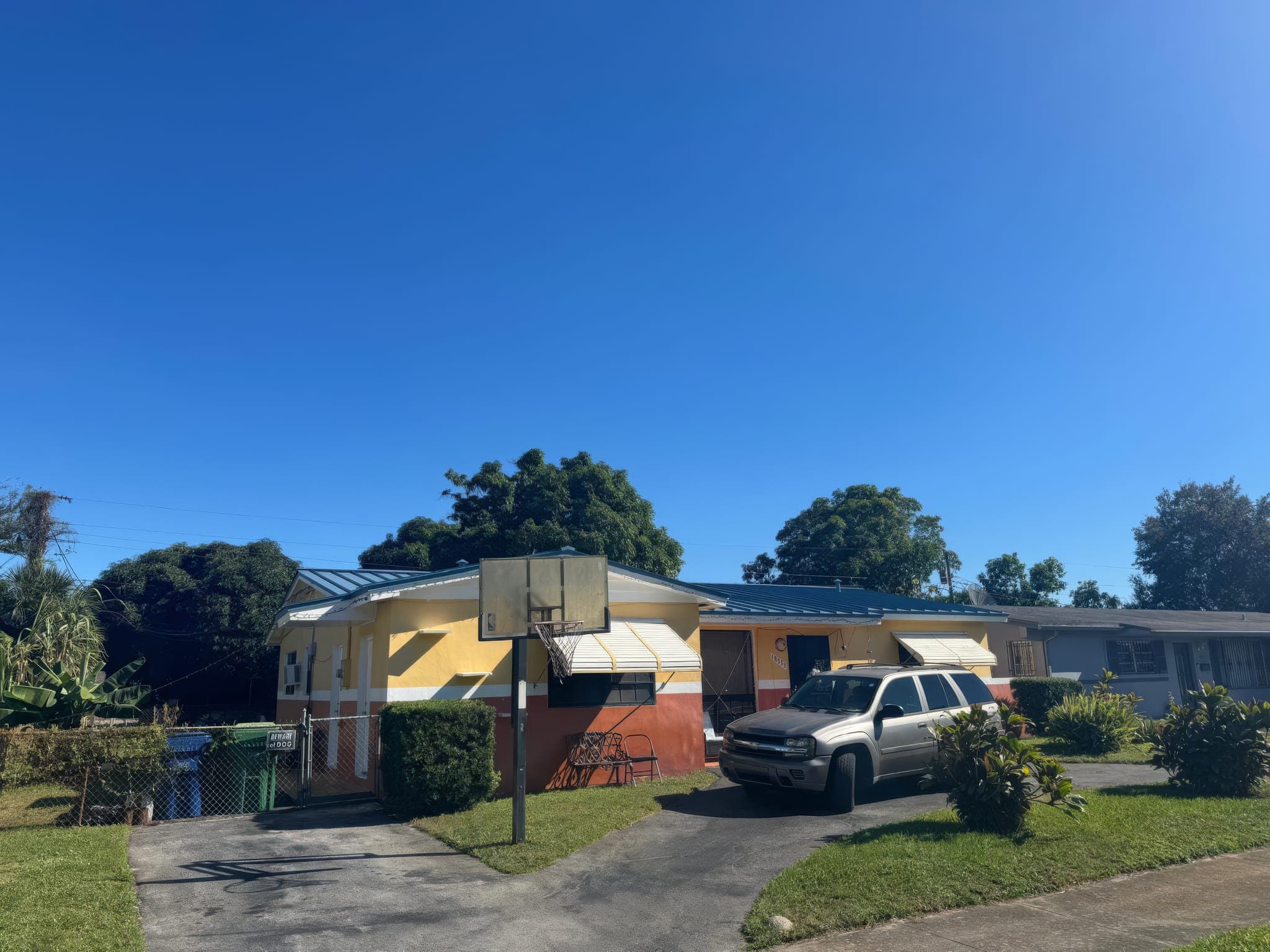 Street view of a home with a new metal roof