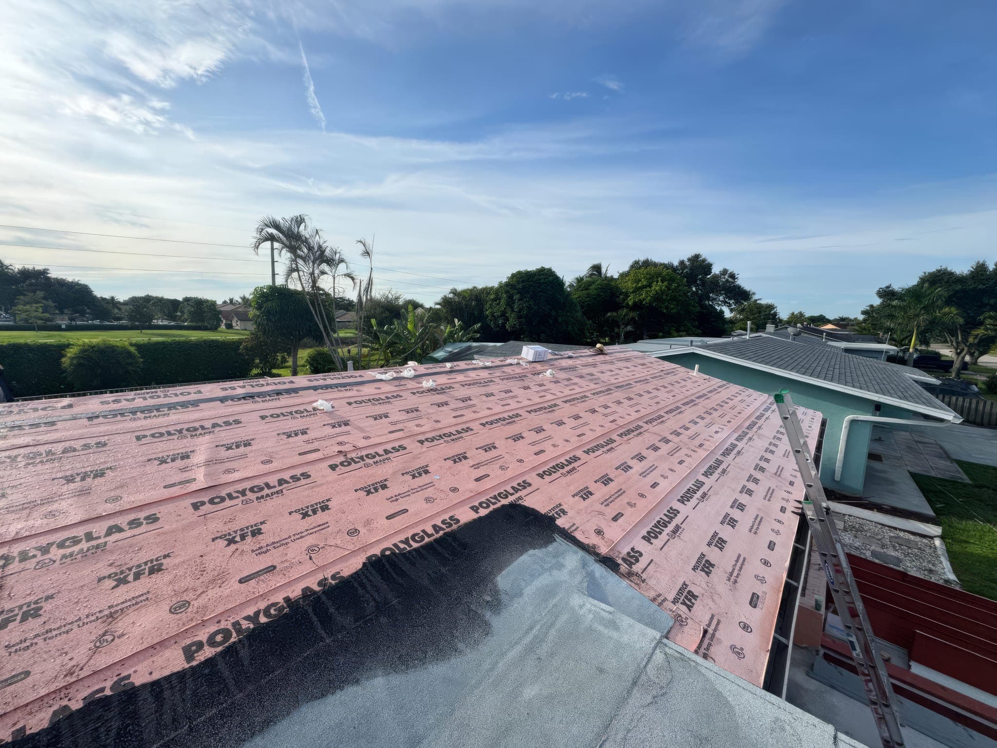 Roof deck covered in underlayment where the two slopes meet