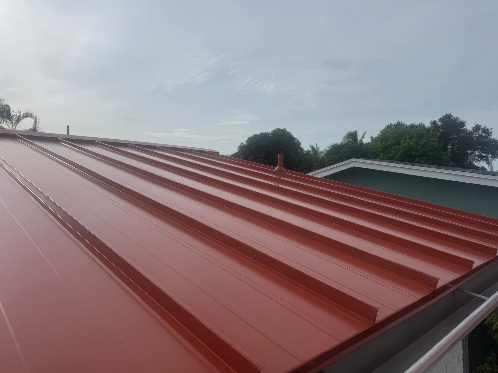 Concealed-fastener standing seam panels across the full roof