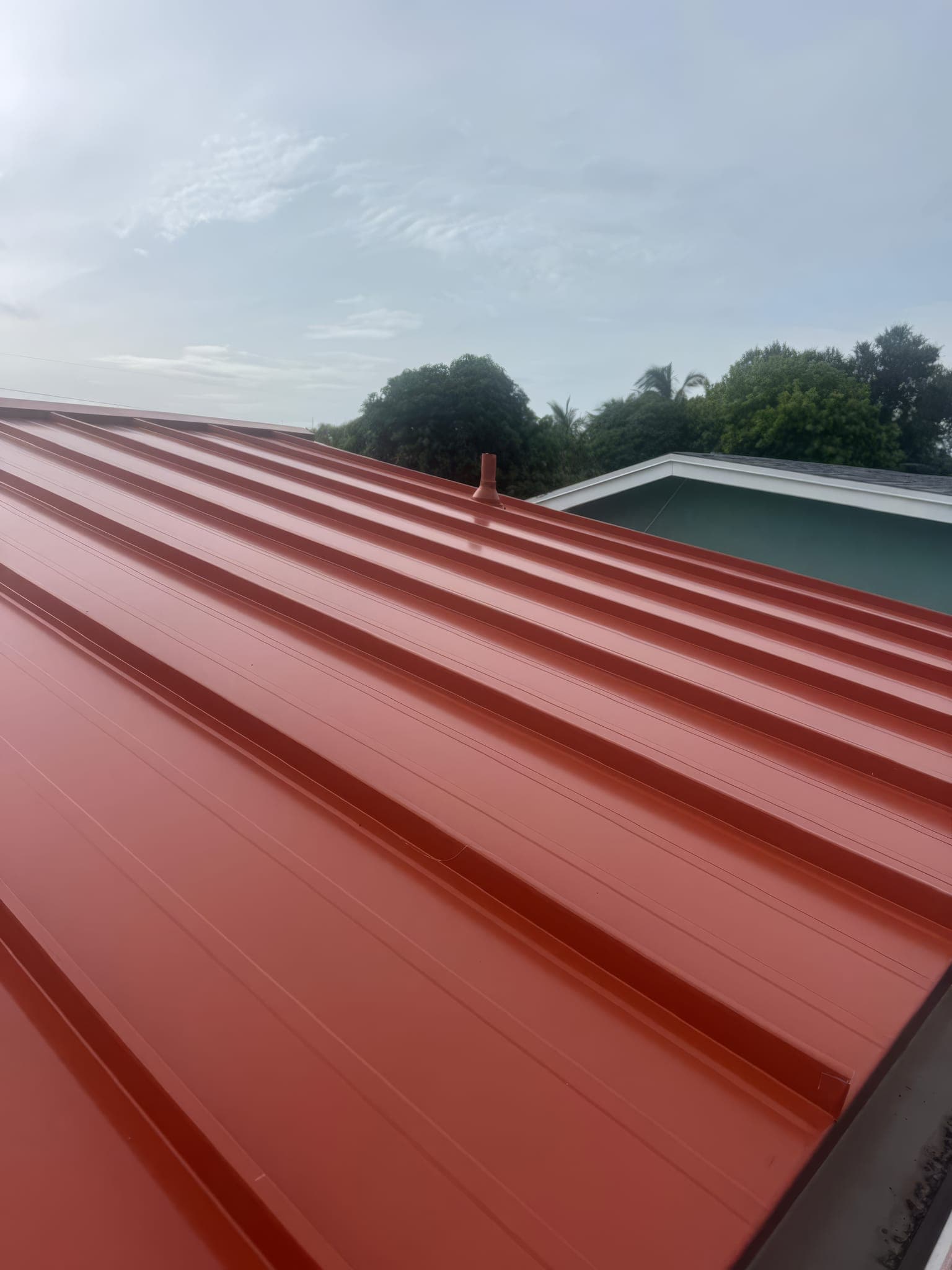 Standing seam panels at the eave of the finished roof