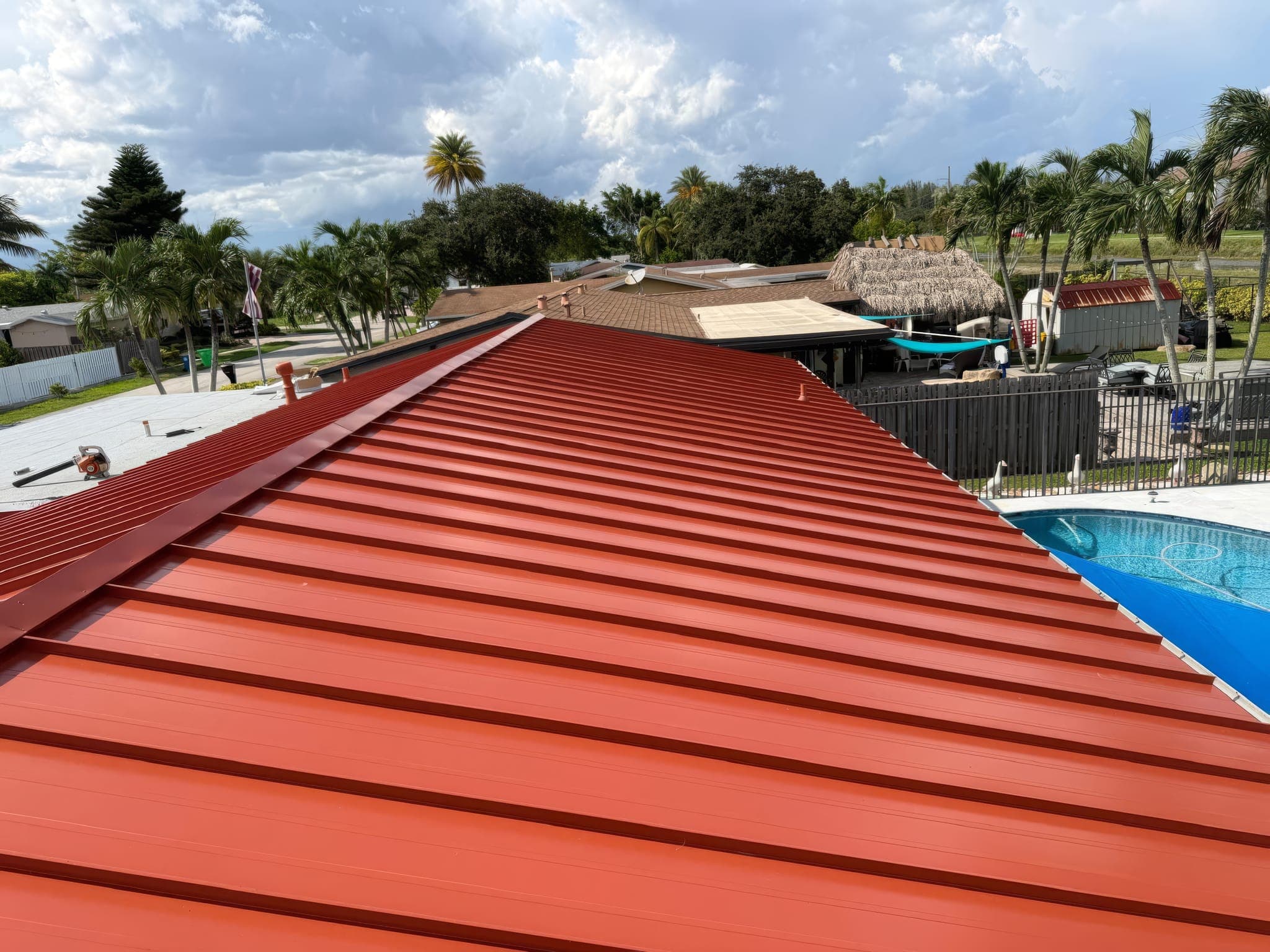 Aerial view along the ridge of the finished standing seam roof