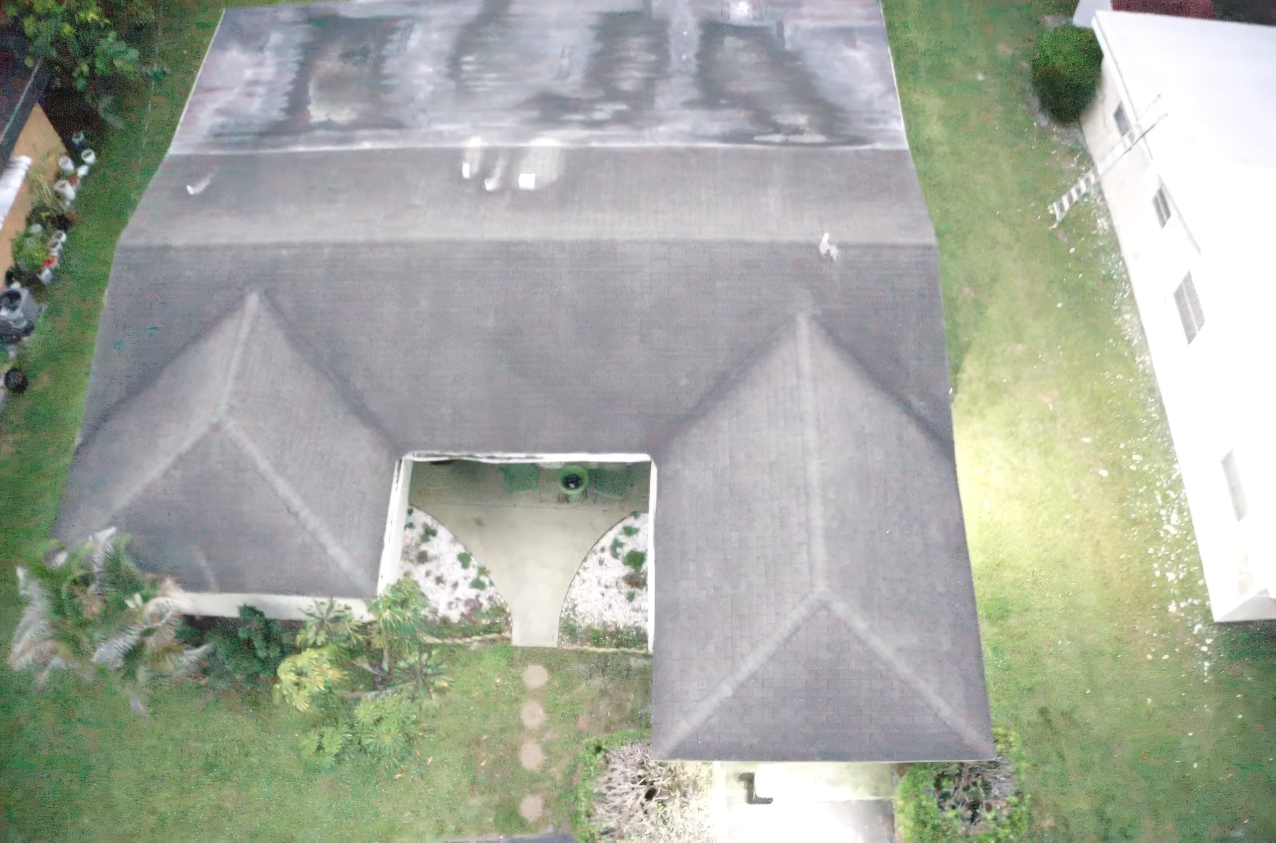 Aerial view of the old shingle roof from the front of the house before tear-off