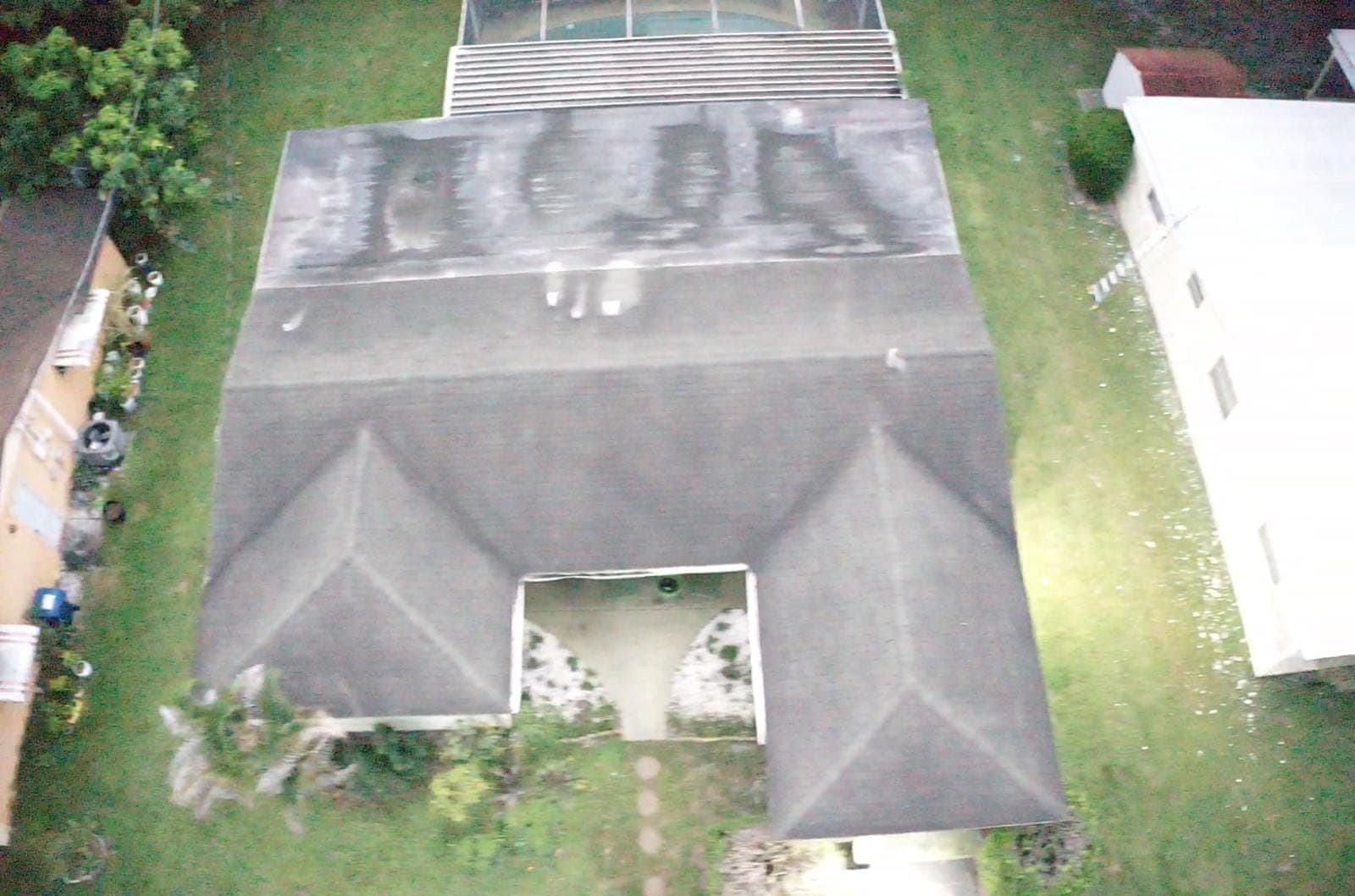Drone inspection photo of a shingle roof with algae streaking