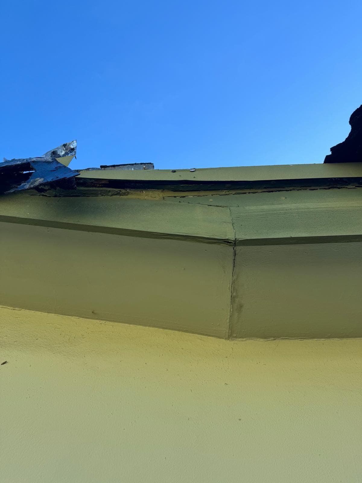 Rotted fascia and drip edge peeling away
